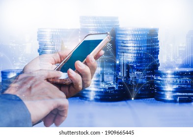 Businessman Using Smartphone With Double Exposure Of Coin Stacking Background For Technology Digital Online Financial Concept Online Trading And Cryptocurrency Investment.