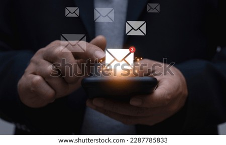 Businessman using smartphone for email with notification, online communication concept.