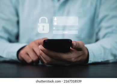 Businessman using smartphone to input username and password for or technology security system and prevent hacker concept. - Shutterstock ID 2167318539