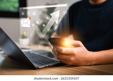 Businessman using smartphone and laptop with digital marketing analytics dashboard, email notification, financial growth graph, data visualization, business communication and technology concept