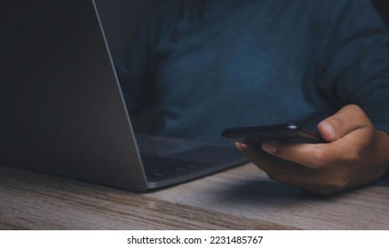 Businessman using smartphone with laptop. Hand holding mobile texting message contact us. chatting, search internet information. Technology device communication connecting. - Shutterstock ID 2231485767