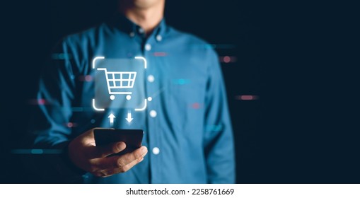 Businessman using a Smartphone with online shopping concept, marketplace website with virtual interface of online Shopping cart part of the network, Online shopping business with selecting shopping ca