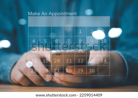 Businessman using smartphone to reserve business schedule plan on virtual screen calendar , Project management concept.
