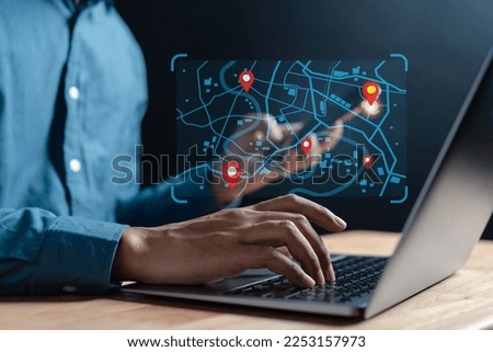 Businessman using smartphone synchronize computer searching world map with location point, GPS app, Destination travel maps and find places in the online system, searching by satellite system.