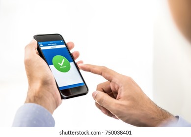 Businessman using smartphone transferring money online via electronic internet banking application - financial technology or fintech concept - Shutterstock ID 750038401