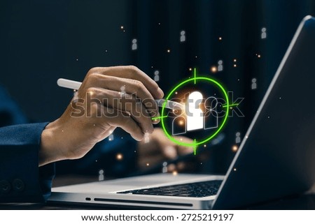 Businessman using stylus to select target audience icon on laptop, representing customer targeting, market segmentation, digital marketing strategy, audience analysis, and data-driven business growth.