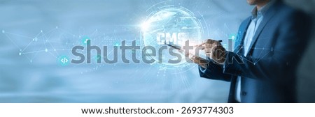 Businessman using tab CMS icon with global network. Content publishing, website management, SEO optimization, media storage, user access control, digital strategy.