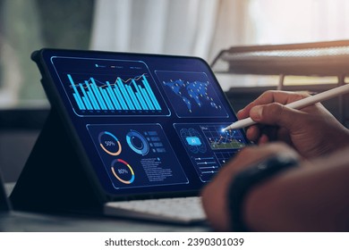 Businessman using tablet Analytics Data KPI Dashboard Tech with charts, metrics, and KPI to analyze performance and create insight reports for operations management.Data mining.Data analysis.Ai - Powered by Shutterstock