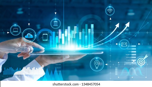 Businessman using tablet analyzing sales data and economic growth graph chart. Business strategy. Abstract icon. Digital marketing.