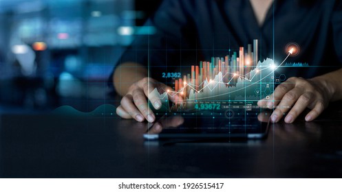 Businessman using tablet analyzing sales data and economic growth graph chart. Business planning and strategy. Analysing trading of exchange. Financial and banking. Technology digital marketing. - Shutterstock ID 1926515417