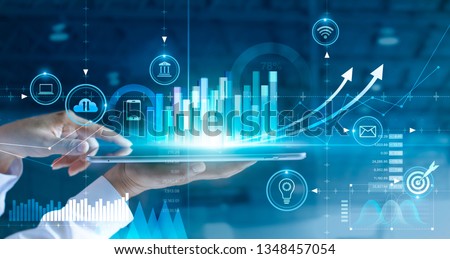 
Businessman using tablet analyzing sales data and economic growth graph chart. Business strategy. Abstract icon. Digital marketing.