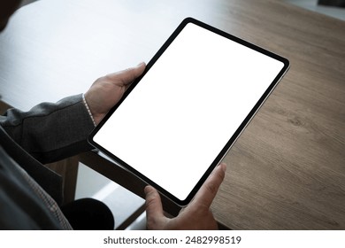 Businessman Using tablet with blank screen for design mockup device Tablet with blank screen for design mockup - Powered by Shutterstock