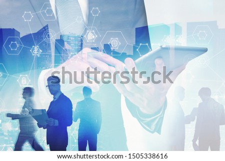 Businessman using tablet computer with blurry business people in background, double exposure of cityscape and immersive hi tech interface. Concept of wireless connection and smart city. Toned image