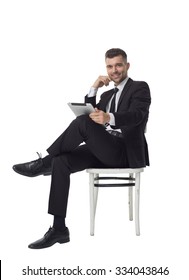 Businessman using tablet computer Full Length Portrait isolated on White Background