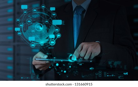 Businessman Using Tablet Computer Shows Internet And Social Network As Concept