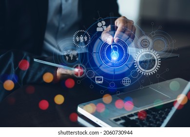 Businessman using tablet with digital interface hologram and Hud security data protection, Business technology and future concept, Blurred background.