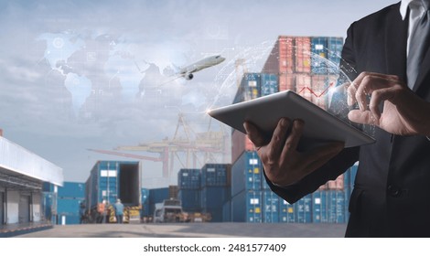 Businessman using tablet for digital logistics management with cargo containers, airplane, and global map overlay. - Powered by Shutterstock