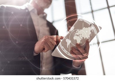 Businessman using tablet, light effect, double exposure