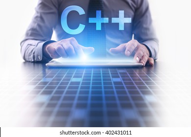 Businessman using tablet pc and select C++.