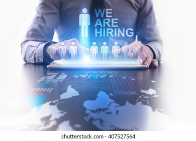 Businessman using tablet pc and select We are hiring.