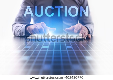 Businessman using tablet pc and select Auction