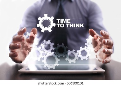 Businessman is using tablet pc and selecting time to think