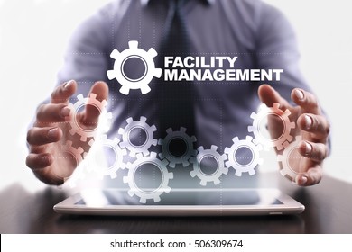 Businessman Is Using Tablet Pc And Selecting Facility Management