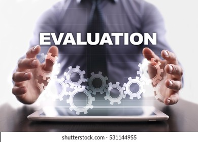 Businessman is using tablet pc and selecting evaluation.