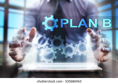 Businessman using tablet pc and selecting plan b.