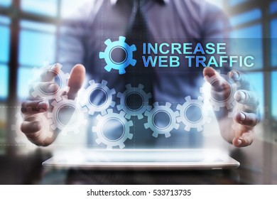 Businessman using tablet pc and selecting increase web traffic.
