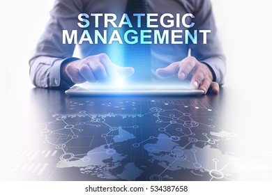Businessman is using tablet pc and selecting strategic management.
