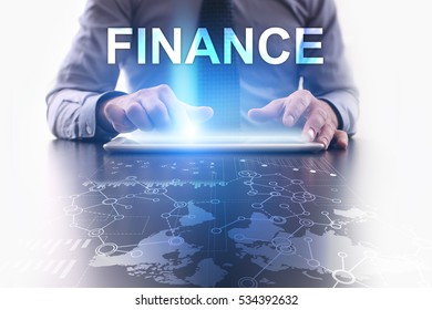 Businessman is using tablet pc and selecting finance.