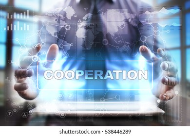 Businessman using tablet pc and selecting cooperation.