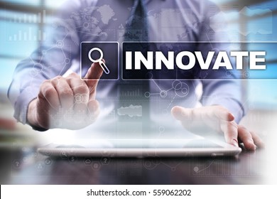 Businessman using tablet pc and selecting innovate.