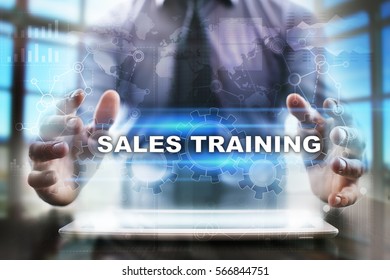 Businessman Using Tablet Pc And Selecting Sales Training.