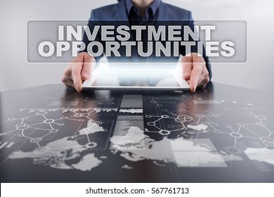 Businessman Using Tablet Pc And Selecting Investment Opportunities.