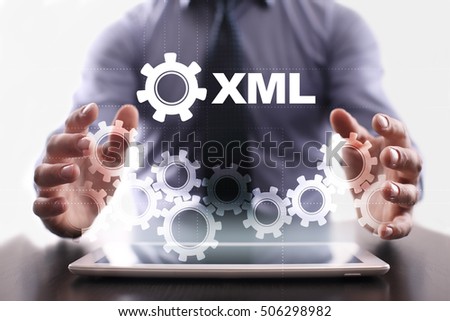 Businessman is using tablet pc and selecting xml