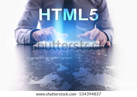Businessman is using tablet pc and selecting html5.