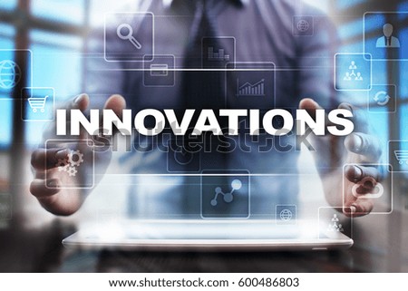 Businessman using tablet pc and selecting innovations.