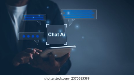 Businessman using tablet show AI chat with virtual screen internet connection to create command prompts with artificial intelligence robot technology, concept of futuristic technology transformation. - Shutterstock ID 2370585399