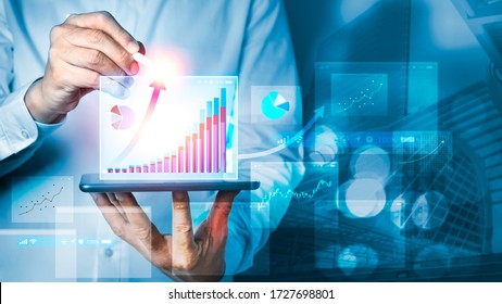 Businessman Using Tablet And Technology. Digital Marketing Of Sales And Economic Growth Graph Chart. Business Strategy Abstract Graphic Background