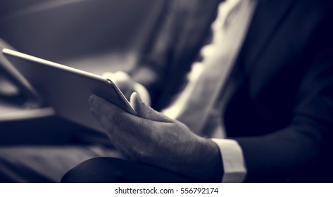 Businessman Using Tablet Working Car Inside - Shutterstock ID 556792174