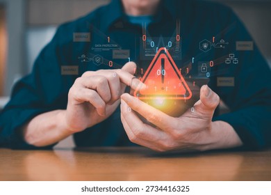 Businessman using tech device with triangle warning sign and icons in notification error and maintenance concept. hacker attacks and hacking data, cyber crime, cyber security