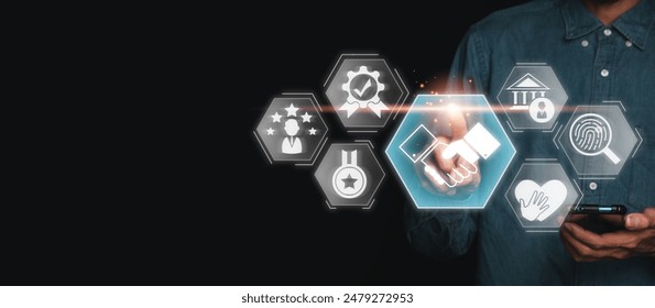 Businessman using a virtual interface to emphasize the concept of credibility with icons representing trust, quality, and reliability. - Powered by Shutterstock