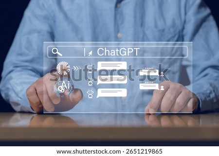 Businessman using virtual interface to search and interact with ChatGPT AI chatbot. Concept of artificial intelligence and smart digital assistant.