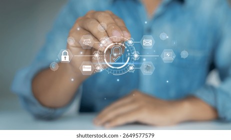 Businessman using virtual interface with security lock icon, representing cybersecurity, data privacy protection, and digital technology safety.