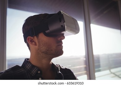Businessman using virtual reality technology at office