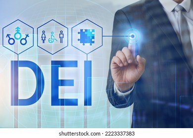 Businessman using virtual screen with abbreviation DE and I (diversity, equity, inclusion) on light background - Shutterstock ID 2223337383