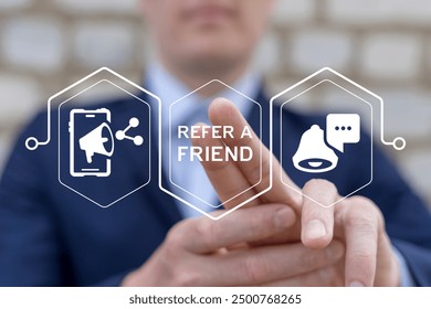 Businessman using virtual screen presses text: REFER A FRIEND. Referral marketing or affiliate marketing concept. Invite friends to refer a friend loyalty program to win online reward. Refer and earn.