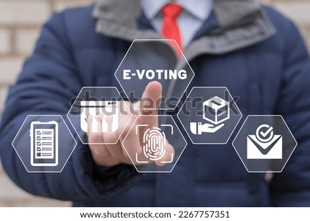 Businessman using virtual touch screen presses inscription: E-VOTING. Mixed environment, e-voting technology concept. Online Internet Electronic Voting.